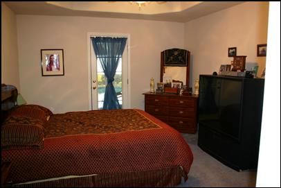 Master Bedroom with raised ceiling opens into the pool area